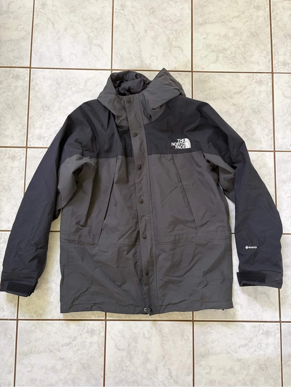 The North Face Men’s Black and Gray Waterproof Hooded Raincoat